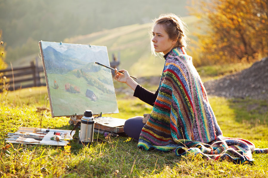 artist painting a mountain scene, CA