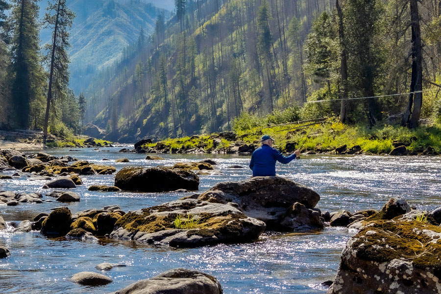 fisherman in river